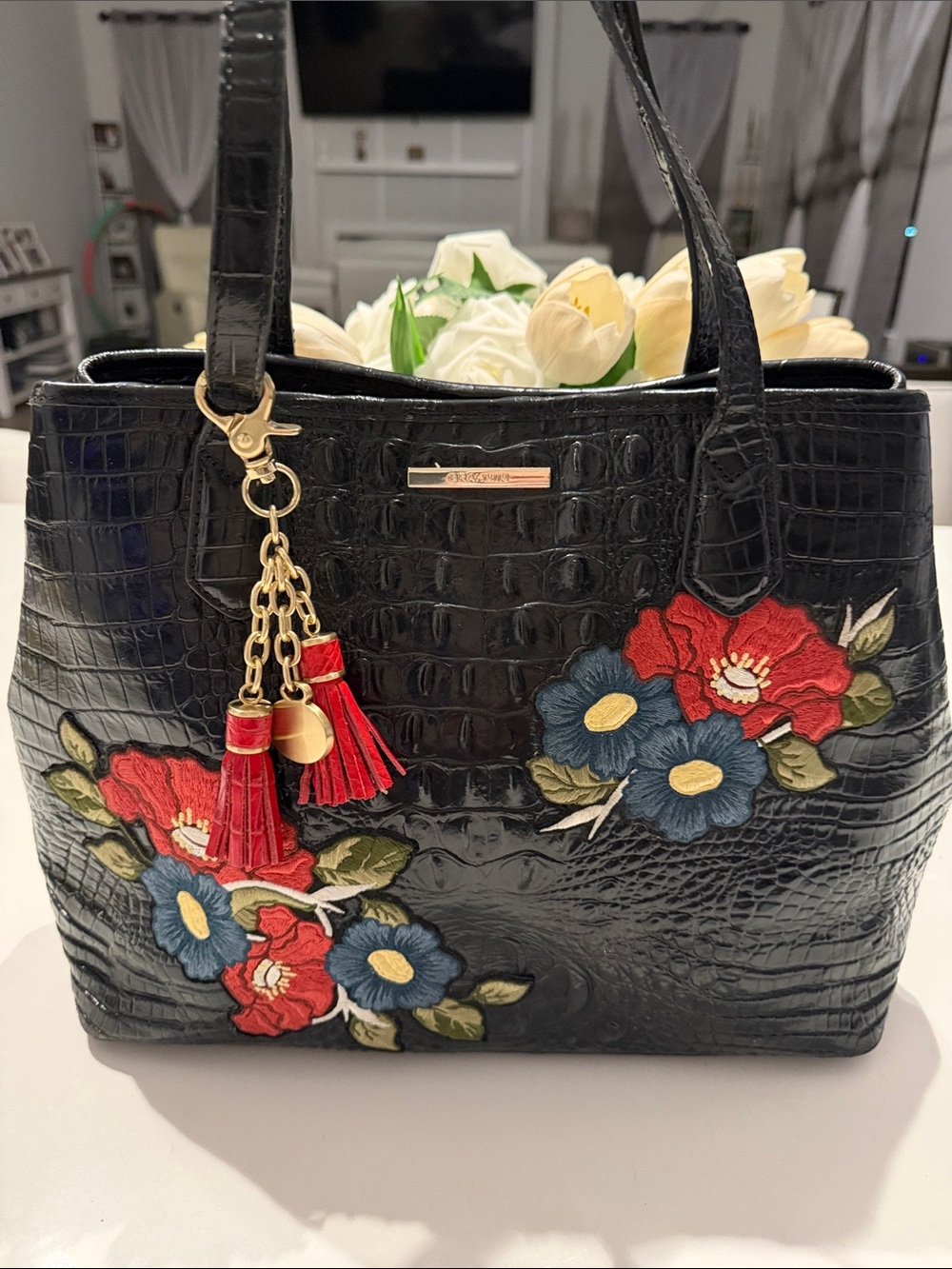 Brahmin Black Floral Embroidered Tote Bag with Red Tassel Charm